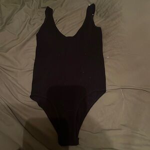 black body suit, never worn